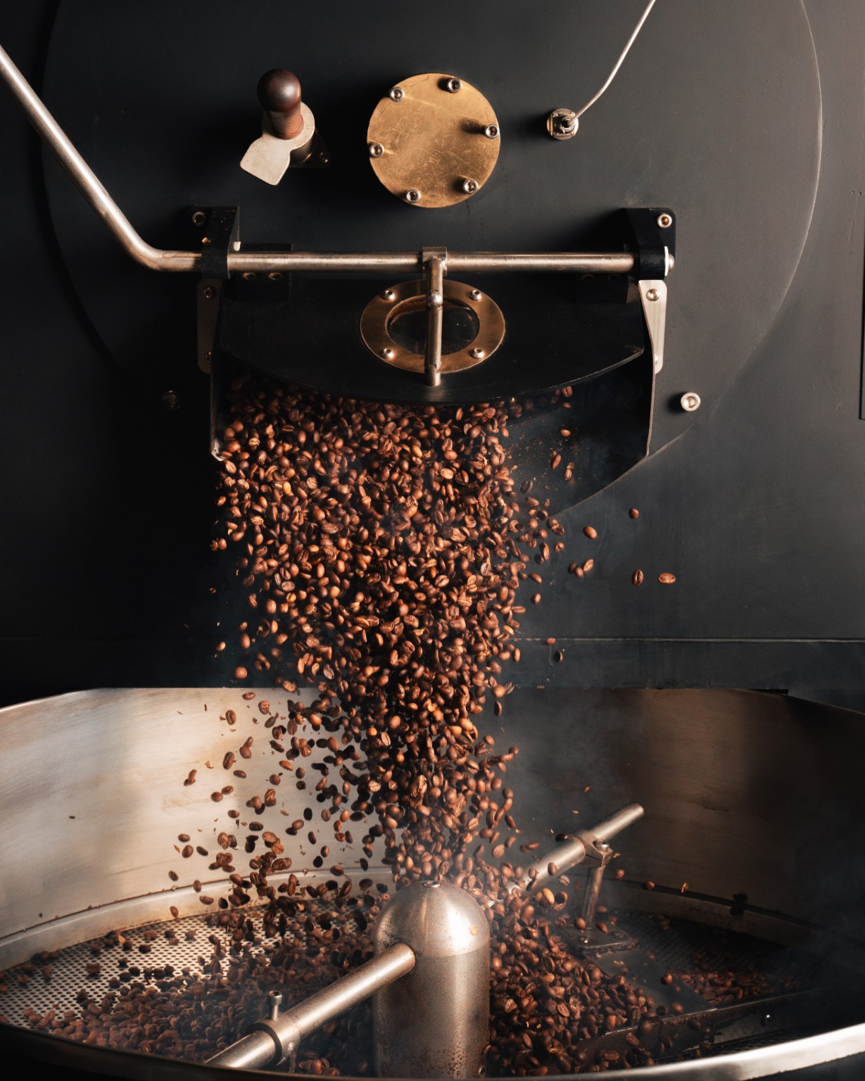 Coffee beans pouring from the Northside roaster